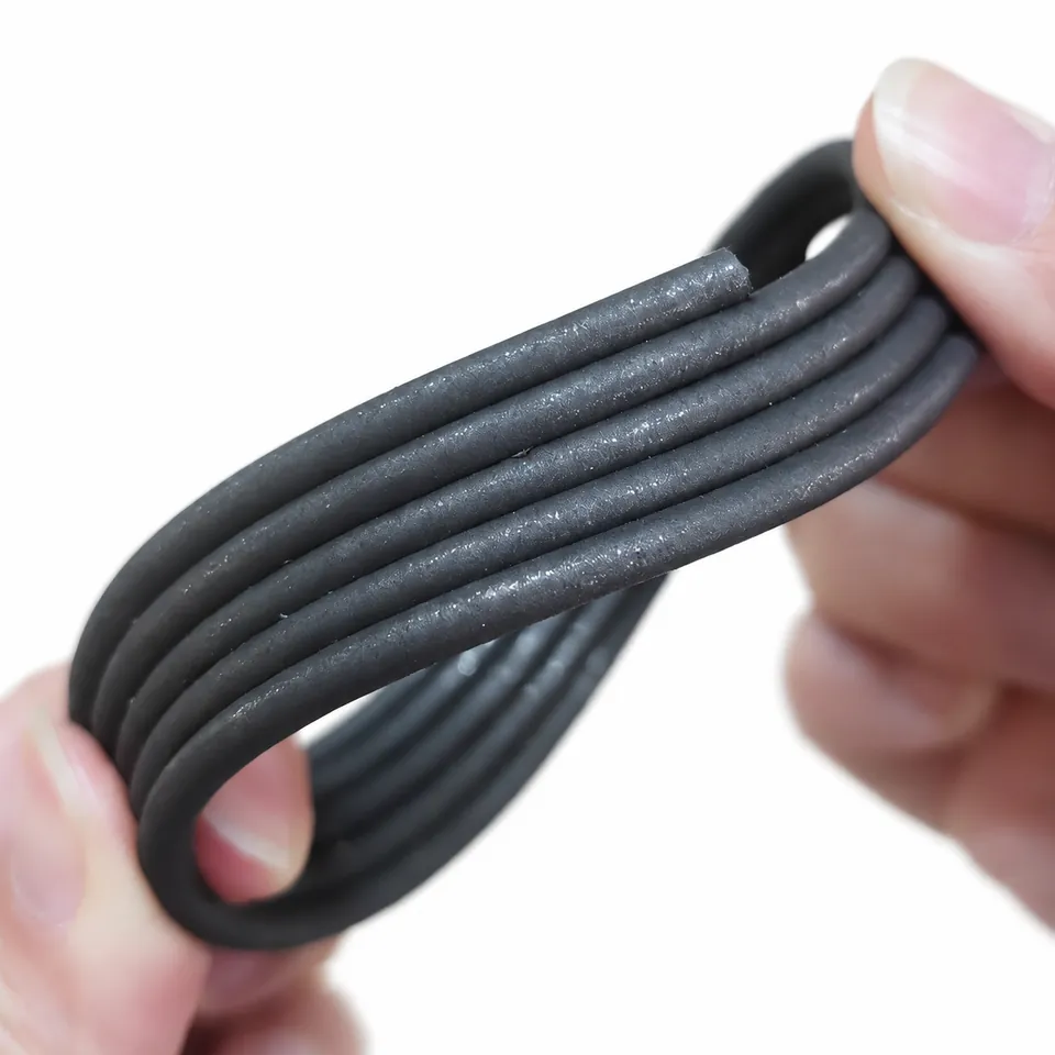 A hand bending several lengths of gray flexible magnetic cord.