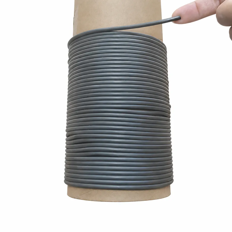 Gray magnetic cord wound around a tall cardboard core.