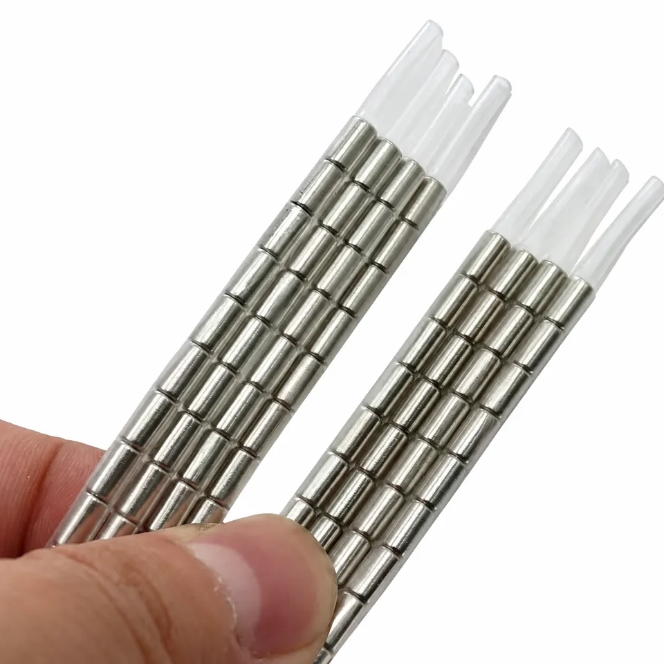 Two hand-held bundles of segmented metal magnetic cords inside clear sleeves.