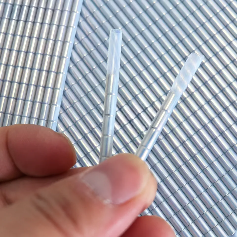 Two sleeved segmented magnetic cord samples held over parallel lengths.